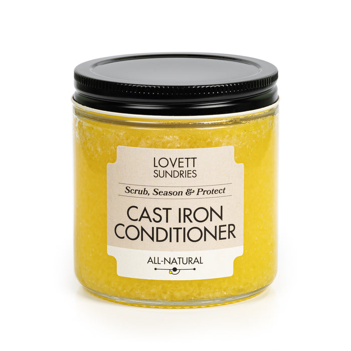 Lovett Sundries Cast Iron Conditioner, with a black lid, promises to scrub, season, and protect your cast iron cookware. This yellow, all-natural solution maintains a natural non-stick surface on your pans and is ready for use.