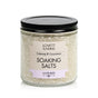 A clear jar with a black lid contains Lovett Sundries Soaking Salts. The label reads “Calming & Luxurious Soaking Salts, Lavender.” Off-white crystals made with natural ingredients provide a soothing aromatherapy experience.