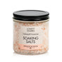 Lovett Sundries Soaking Salts come in a clear jar with a black lid. These pale pink, natural “Calming & Luxurious” salts in Orange Blossom scent are perfect for aromatherapy.