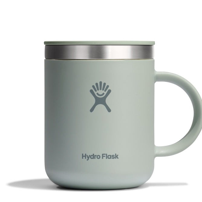 A light green Hydro Flask Stainless Steel Mug (12 oz) features a right-hand handle, stainless steel rim, and splash-resistant lid. The Hydro Flask logo is centered on the front.