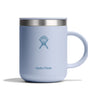 A 12 oz Hydro Flask stainless steel mug featuring the brands logo, in light blue with a handle and splash-resistant lid, set against a plain white background.