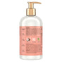 A clear pump bottle with a gold dispenser holds SheaMoisture’s Conditioner - Curl + Shine, a hair product featuring coconut oil, silk protein, and neem oil on the label—ideal for boosting curl definition and shine. Free from parabens, phthalates, propylene glycol, and mineral oil, this conditioner is specially designed to tame frizz and leave your locks smooth and radiant.