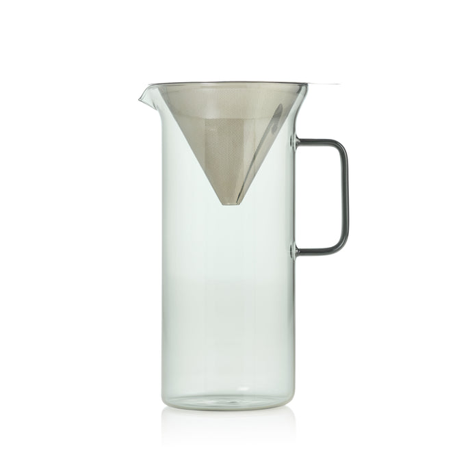 The AdHoc Stainless Steel & Glass Pour Over features a clear borosilicate glass pitcher with a simple handle and a built-in fine mesh stainless steel filter, displayed against a plain white background.