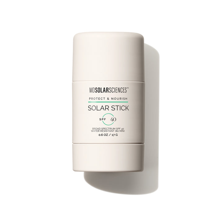The MDSolarSciences Solar Stick SPF 40, a portable mineral sunscreen stick enriched with vitamins C & E, stands upright in its beige tube with the label clearly visible against a white background.