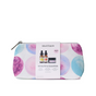 A zippered cosmetic pouch with a watercolor circle pattern and a belly band displaying The Winter Hydration Gift Set, including a small jar and the text Wintertime Essentials.