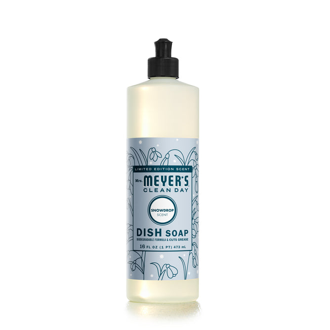 A bottle from Mrs. Meyers A Touch of Holiday Magic Set - Snowdrop scent adds festive charm with a light blue label featuring snowdrop illustrations and a sleek black flip-top cap, containing 16 fl oz (473 ml) of enchanting dish soap.