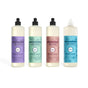 The Mrs. Meyer's Spring Dish Soap Collection includes four bottles in Lilac, Mint, Rose, and limited edition Compassion Flower scents, each with unique floral designs and colored labels.