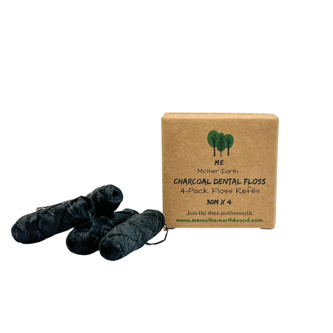 Four black rolls of Eco Floss Refills by Me Mother Earth sit beside a brown box labeled “Eco Floss Refills 4-Pack 30M x 4” with a green tree logo, showcasing this zero waste floss alternative.