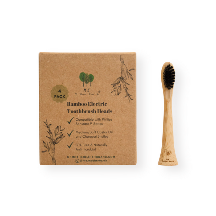 A box labeled Me Mother Earth Bamboo Electric Toothbrush Heads- Sonicare Compatible sits beside a single bamboo head with black bristles. The brown, botanical packaging highlights these sustainable Philips Sonicare replacements.