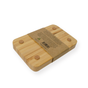 The Me Mother Earth Bamboo Draining Soap Dish features a rectangular design with four round anti-slip pads and a self-draining base, wrapped in a brown recyclable paper label with text and recycling symbol, shown on a white background.