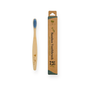 The Me Mother Earth Kids Colorful Bamboo Toothbrush with Castor Oil Bristles is shown beside its eco-friendly brown cardboard packaging, accented with green and labeled for kids, reflecting a commitment to sustainable oral care.