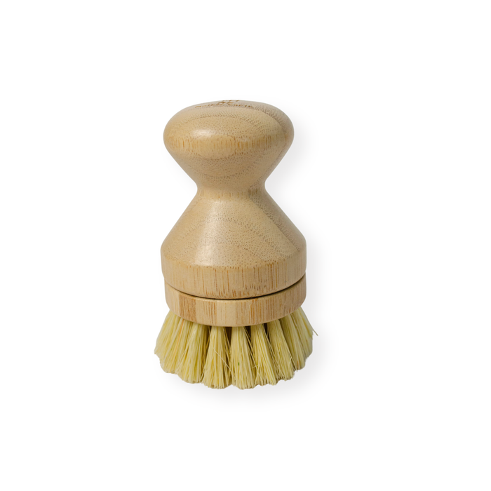 The Me Mother Earth Modular Sisal Multipurpose Brush has plant-based bristles and a rounded handle, with stiff bristles in a circular base—ideal for zero waste cleaning and shown upright on a white background.