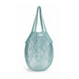 The "One Tripper" Expandable Mesh Market Bag by Me Mother Earth is a light blue, reusable organic cotton bag with two handles, ideal for carrying groceries or produce. Shown empty against a white background.
