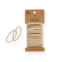 Me Mother Earth Hair Ties made from cotton and natural rubber come in beige on a brown cardboard holder. Two plastic-free ties are shown separately, highlighting this eco-friendly, organic hair tie pack.