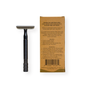A black Me Mother Earth Reusable Double Edge Safety Razor lies flat beside a brown cardboard box with black printed instructions and product details, set on a white background—perfect for zero waste shaving.