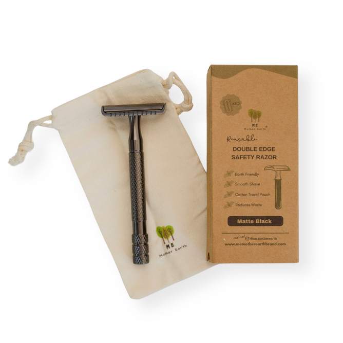 The Me Mother Earth Reusable Double Edge Safety Razor, with a matte black finish, comes with a drawstring pouch and an eco-friendly brown box showing product details—all arranged on a white background for zero waste shaving.