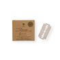 A cardboard box labeled "Safety Razor Refill Pack" by Me Mother Earth sits next to a single stainless steel replacement blade on a white background. The box highlights eco-friendly branding and includes the company’s web address.