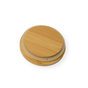 The Me Mother Earth Solid Bamboo Mason Jar Lid, round and light-colored with smooth edges, is shown stacked on a slightly larger beige silicone seal lid against a white background.