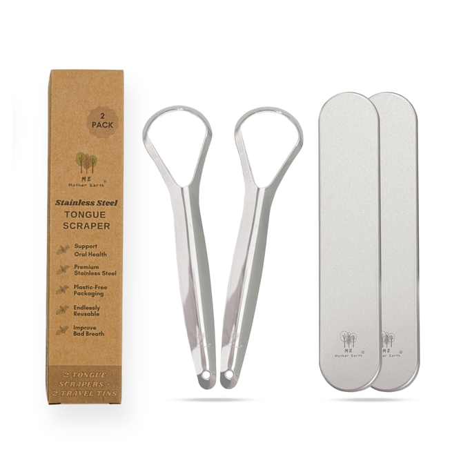 Two Me Mother Earth Stainless Steel Tongue Scrapers + Travel Tins are shown between a brown box labeled "Stainless Steel Tongue Scraper" and two silver tins, all displayed on a white background.