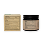 A brown glass jar and a cardboard box from Me Mother Earth display labels with directions, warnings, and ingredients in black on beige. These plastic-free Toothpaste Tablets with Fluoride - Zero Waste are travel-friendly, with small detailed text on their packaging.