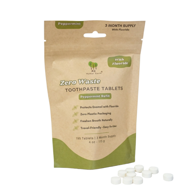 A resealable brown pouch labeled "Me Mother Earth Zero Waste Toothpaste Tablets with Fluoride - 3 Month Refills" in peppermint flavor, made from plant-based, eco-friendly packaging, with white tablets shown in front.