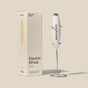 A white Modern Whisk by Morning Made stands upright next to its beige box labeled "Modern Whisk"—your go-to electric frother for smooth, effortless coffee blends.