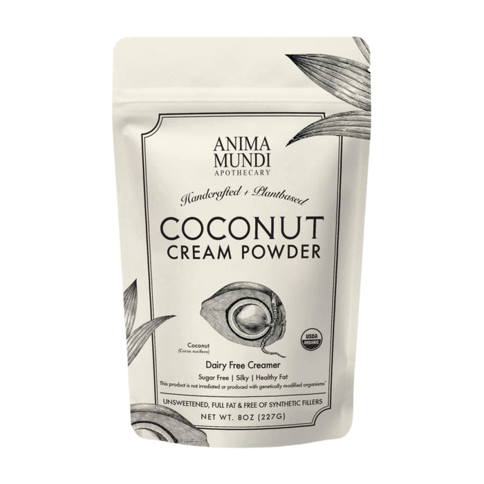 A white resealable pouch labeled Anima Mundi COCONUT CREAM, Dairy Free Creamer features botanical art and product details, highlighting its USDA organic, dairy-free, unsweetened, and made from nutrient-rich coconut meat—a true superfood.