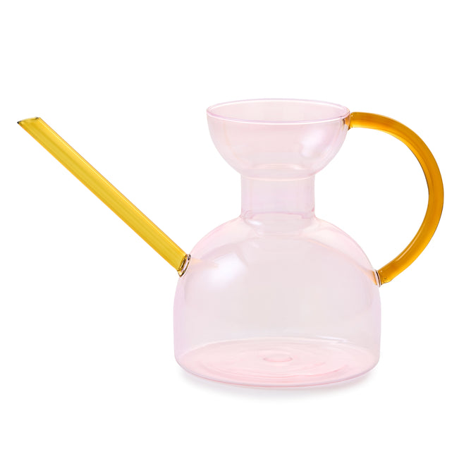The Handcrafted Borosilicate Glass Watering Can by Modern Sprout features a translucent pink body, wide opening, yellow spout and handle—ideal as a plant propagation vessel or stylish flower vase.