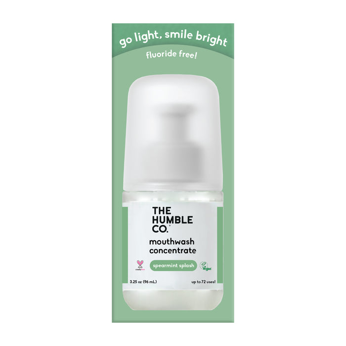 A travel-sized The Humble Co. Mouthwash Concentrate in Spearmint Splash, packaged in eco-friendly green with go light, smile bright and fluoride free! across the top.