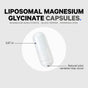 A white Codeage Magnesium Glycinate capsule, 0.87 inches long with natural color variations, is displayed on a light background—an advanced liposomal magnesium supplement made with quality ingredients.