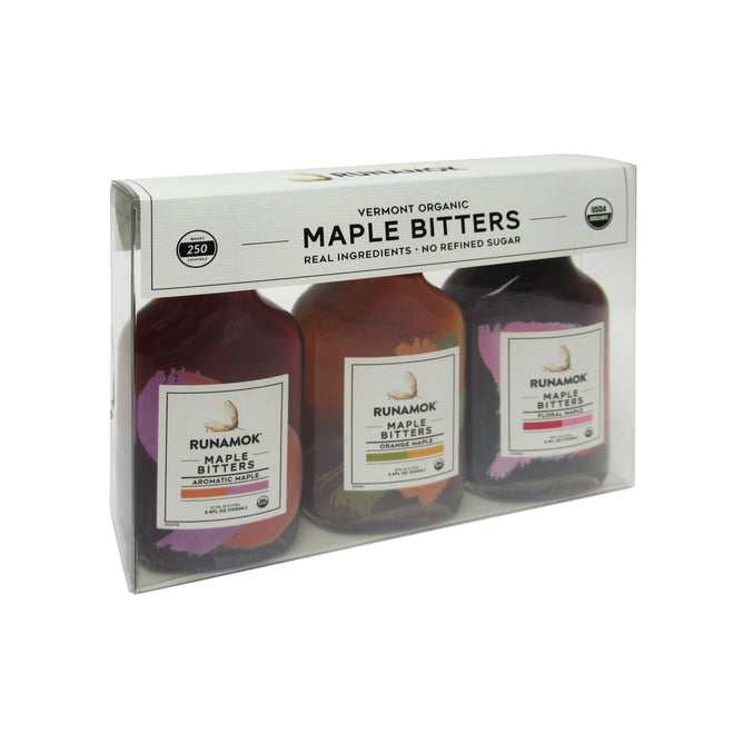 The Runamok Maple Bitters Collection is a boxed set of three bottles, each featuring real ingredients and no refined sugar—perfect for cocktail enthusiasts seeking exquisite aromatic maple bitters.