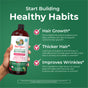 A hand holds a bottle of MaryRuth's Morning Multivitamin + Hair Growth Liquid against a green background. Text with checkmarks highlights benefits: supports hair thickness, thicker hair, and improved wrinkles.