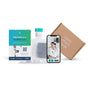 The Million Marker Test Kit for Plastic Chemical Exposure and Fertility includes instructions, a sample container, a mailer, and a brown box labeled “Learn what’s inside,” along with access to video consultations with a doctor—all designed to help you test for hormone-disrupting chemicals.