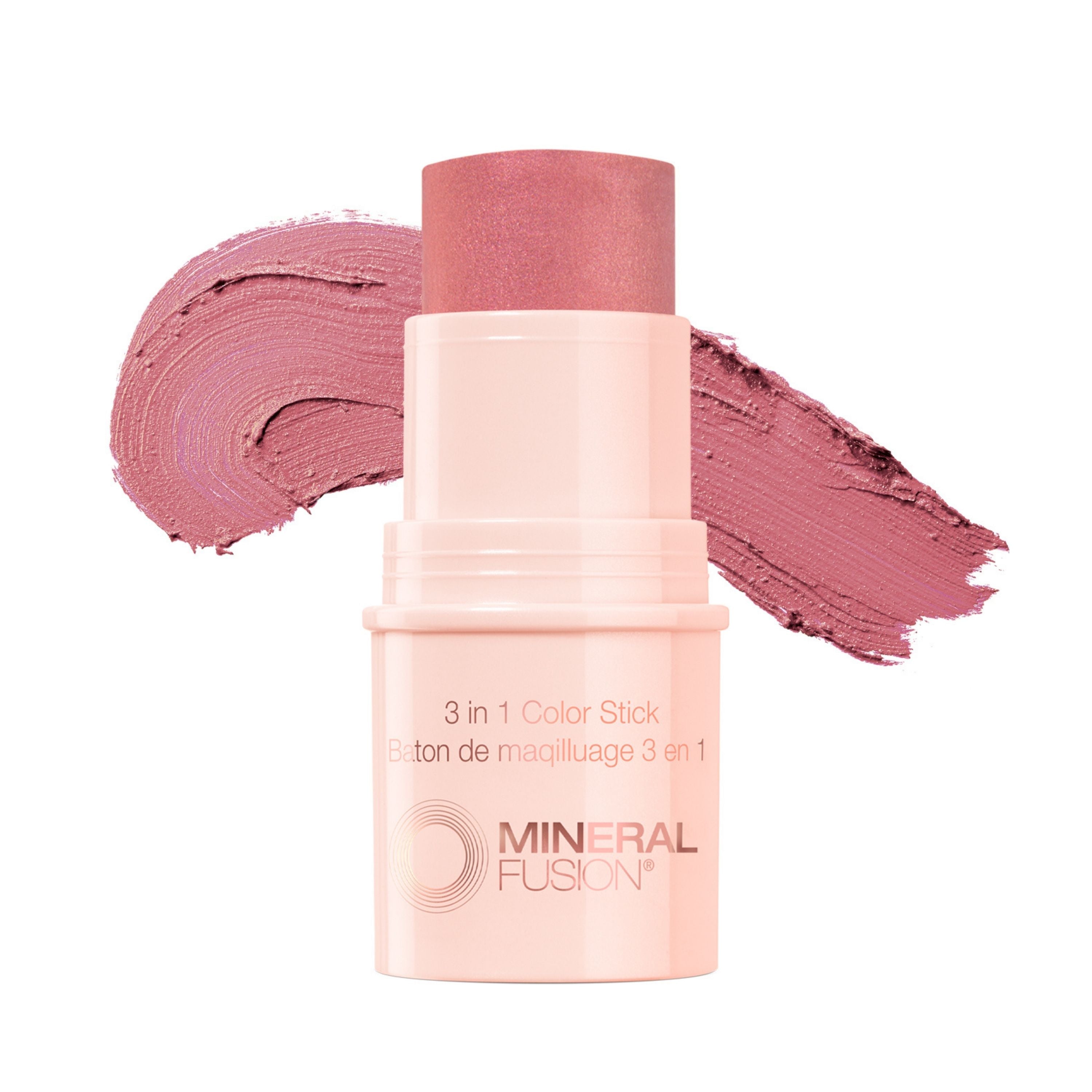 Mineral Fusion 3-in-1 Color Stick in pink is shown uncapped, with a rosy mauve swatch behind it, highlighting its creamy texture—ideal as a lip or cheek tint for easy, natural color.