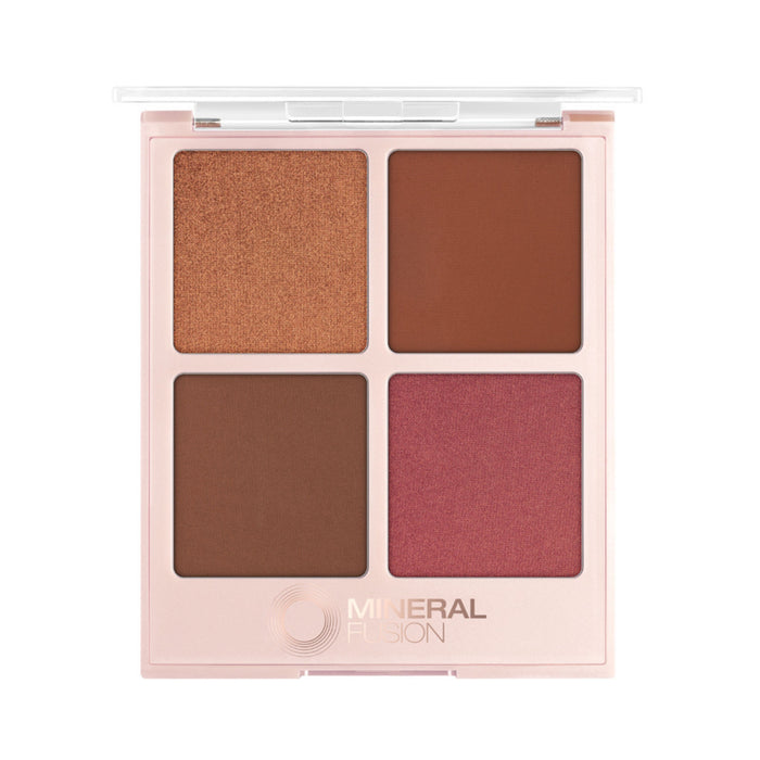 The Mineral Fusion Nightlife Complexion Palette features four shades—shimmery bronze, matte brown, matte reddish-brown, and matte rose—in a square pale pink case with a clear lid, perfect for use as blush or bronzer.