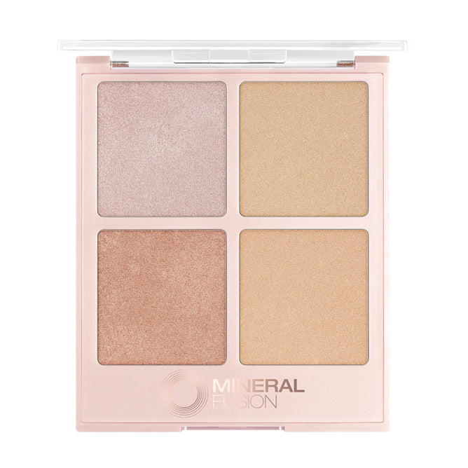 The Mineral Fusion Highlighter Palette features four shimmery pressed powders—light pink, gold, bronze, and champagne—in a square case with a clear lid for an enchanting glow.
