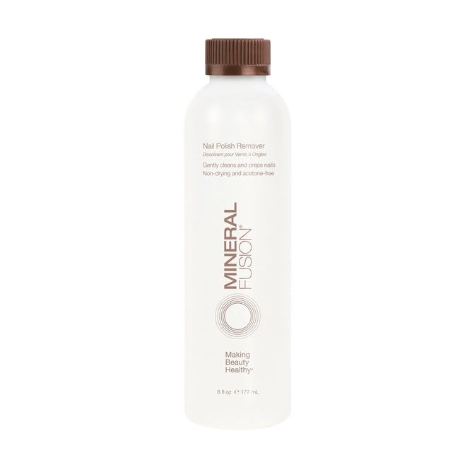 A 6 fl oz (177 mL) white bottle of Mineral Fusion Nail Polish Remover with a brown cap, minimalist label, brown text, circular designs, and an acetone-free formula.