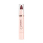 A Mineral Fusion Sheer Moisture Lip Tint with a light pink tube, clear cap, and twist-up hydrating dark mauve color exposed at the top. Mineral Fusion is printed vertically on the naturally derived tube.