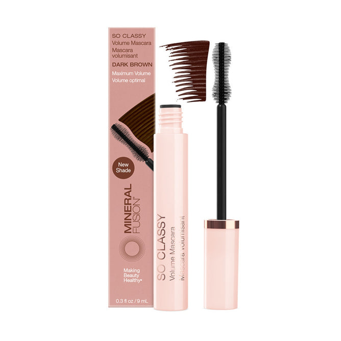 Mineral Fusion So Classy Volume Mascara in dark brown is pictured with its box. The volumizing wand shows product on the bristles, and a dark brown swatch appears above.