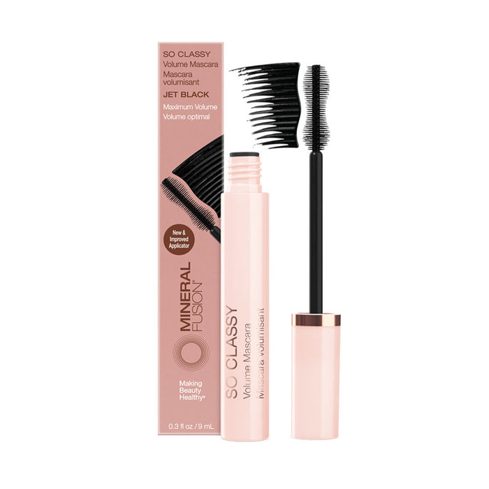 Mineral Fusion So Classy Volume Mascara in jet black is shown with its wand and matching pink box. Text highlights the mascara’s new, improved formula for fuller lashes and maximum volume.