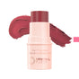 A Mineral Fusion 3-in-1 Color Stick in pink is uncapped to display the makeup stick, with a mauve-pink cheek tint swatch behind it highlighting the versatile shade and creamy texture.