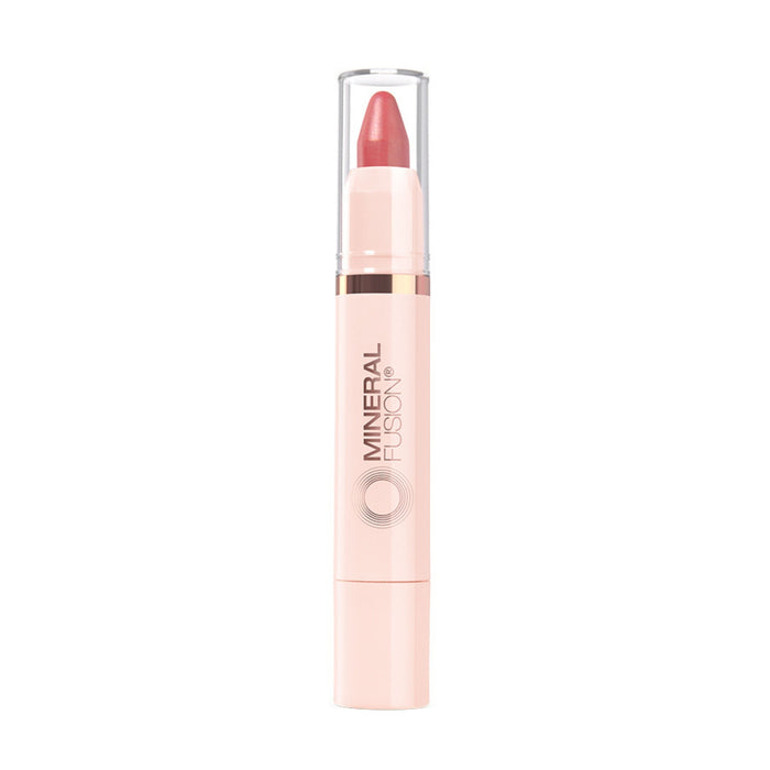 Mineral Fusion Sheer Moisture Lip Tint is a pink lipstick crayon with a clear cap and light beige tube, offering naturally derived, hydrating lip color.