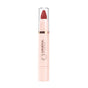 A Mineral Fusion Sheer Moisture Lip Tint with a pinkish-beige body, clear cap, and red tip stands upright against a white background.