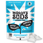 A blue and white bag of Molly’s Suds Ultra Concentrated Laundry Detergent Pods for sensitive skin features claims of safer ingredients, powerful clean, and 60 pods. Three white pods appear in the bottom right corner.