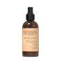 A brown spray bottle from Muse Apothecarys Olive Collection features a black nozzle and cap, plus a beige label with product info, ingredients, instructions, and cautions for the Room Spray - Olive Collection.