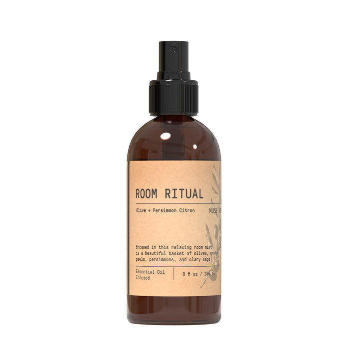 Room Spray - Olive Collection by Muse Apothecary features a brown bottle and essential oils, blending persimmon citron with olive grove for a relaxing, fruity-citrusy room scent.