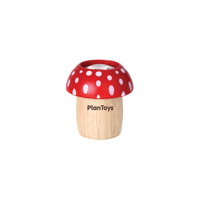 The PlanToys Mushroom Kaleidoscope features a natural wood stem, red cap with white spots, and PlanToys on the stem. This eco-friendly toy stands out against a plain white background.