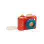 PlanToys’ My First Wooden Toy Camera for Toddlers features a vibrant red body, blue textured lens, yellow buttons, and a white wrist strap—ideal for kids who love eco-friendly play.