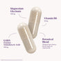 Natrol Sleep & Restore Capsule Non-Melatonin features two clear capsules, each with beige powder. Labels list magnesium glycinate 100mg, vitamin B6 10mg, GABA 100mg, and a botanical blend 25mg—a melatonin-free sleep aid for natural relaxation.