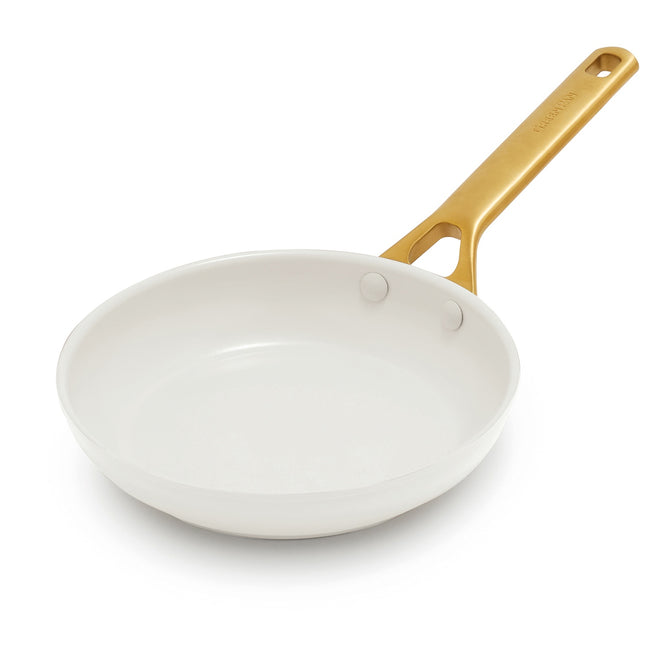 The GreenPan Reserve Pro Open Frypan, a white ceramic nonstick pan with a gold-colored handle, is perfect for toxin-free cooking and is displayed on a plain white background.